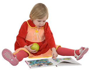 Image showing Small girl looking book