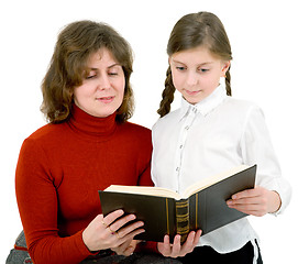 Image showing Woman and girl reads a book