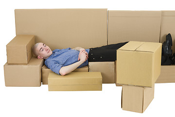 Image showing Man with carton TVset and sofa