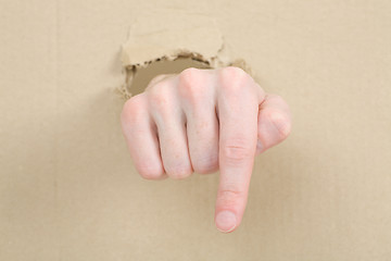 Image showing Gesture male hand through cardboard