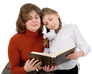 Image showing Woman with girl reading book