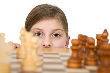 Image showing Girl looking chess