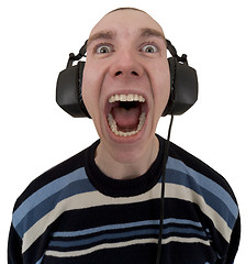 Image showing Man in ear-phones yelling songs