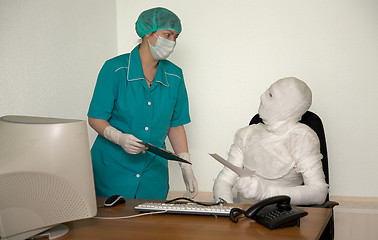 Image showing Patient similar to a mummy and the doctor