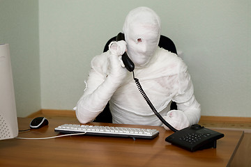 Image showing Businessman mummy with telephone