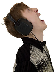 Image showing Young man yell with ear-phones
