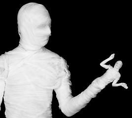 Image showing Phantasmagoric mummy - puppeteer on a black