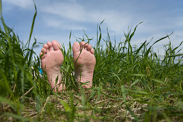 Image showing Barefooted foot in grass