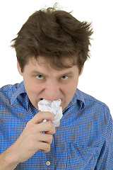 Image showing The man a chewing sheet of paper