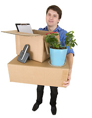 Image showing Man with the big box and a window plant