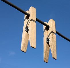 Image showing Two wooden clothes-peg