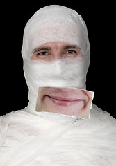 Image showing Guy in bandage with a false smile