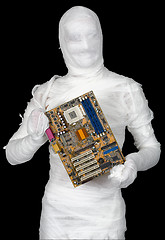 Image showing Man of bandaged with motherboard