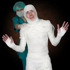 Image showing Man in bandage and nurse