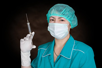 Image showing Nurse with syringe in hand