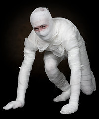 Image showing Guy in bandage on a black