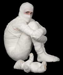 Image showing Egyptian mummy emo sitting on a black