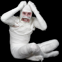 Image showing Man in bandage with false eyes and mouth