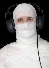 Image showing Man in bandage with ear-phones