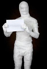 Image showing Mummy with sheet of paper