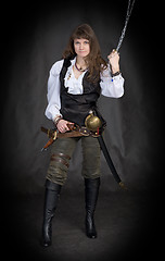 Image showing The girl - pirate with a sabre in hands