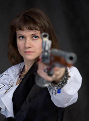 Image showing The girl - pirate with ancient pistol in hand