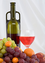 Image showing Bright still life with wine and fruit