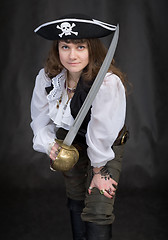 Image showing The girl - pirate with a sabre in hands