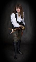 Image showing The girl - pirate with a sabre in hands