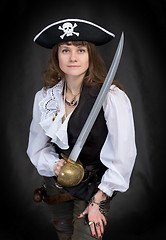 Image showing The girl - pirate with a sabre in hands