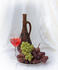 Image showing Bright still life with wine on white