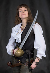 Image showing The girl - pirate with a sabre in hands