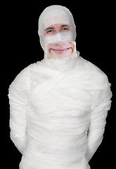 Image showing Guy in bandage with a false smile