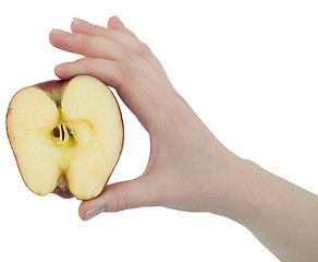 Image showing Cut apple in a female hand