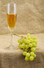 Image showing Wineglass with wine and grapes