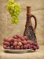 Image showing Grapes and wine in bottle