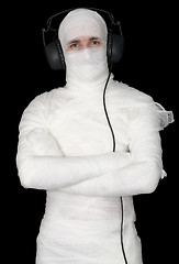 Image showing Man in bandage with ear-phones 