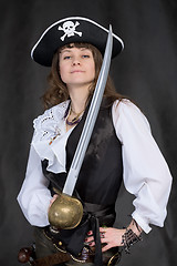 Image showing The girl - pirate with a sabre in hands