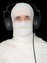 Image showing Man in bandage with ear-phones 