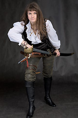 Image showing The girl - pirate with a sabre in hands