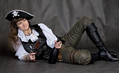 Image showing Drunken girl - pirate with pistol and bottle