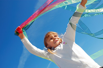 Image showing child playing with ribbons