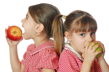 Image showing two girls eating apples