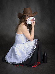 Image showing Girl with a playing-cards in hand