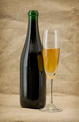 Image showing The champagne bottle and glass