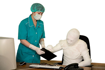 Image showing The bandaged boss and nurse