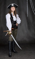 Image showing The girl - pirate with a sabre in hands