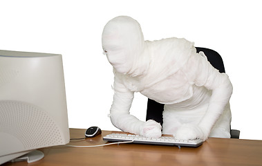 Image showing Bandaged businessman on workplace in office