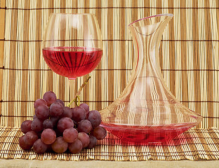 Image showing Still life with decanter, goblet and grapes