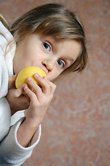 Image showing child eating an apple